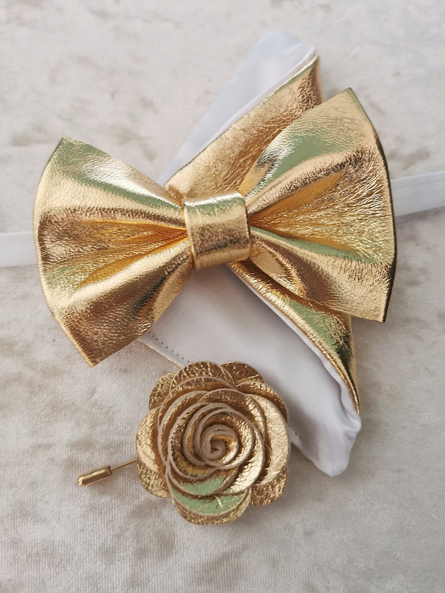 Herrenfliege gold Leder